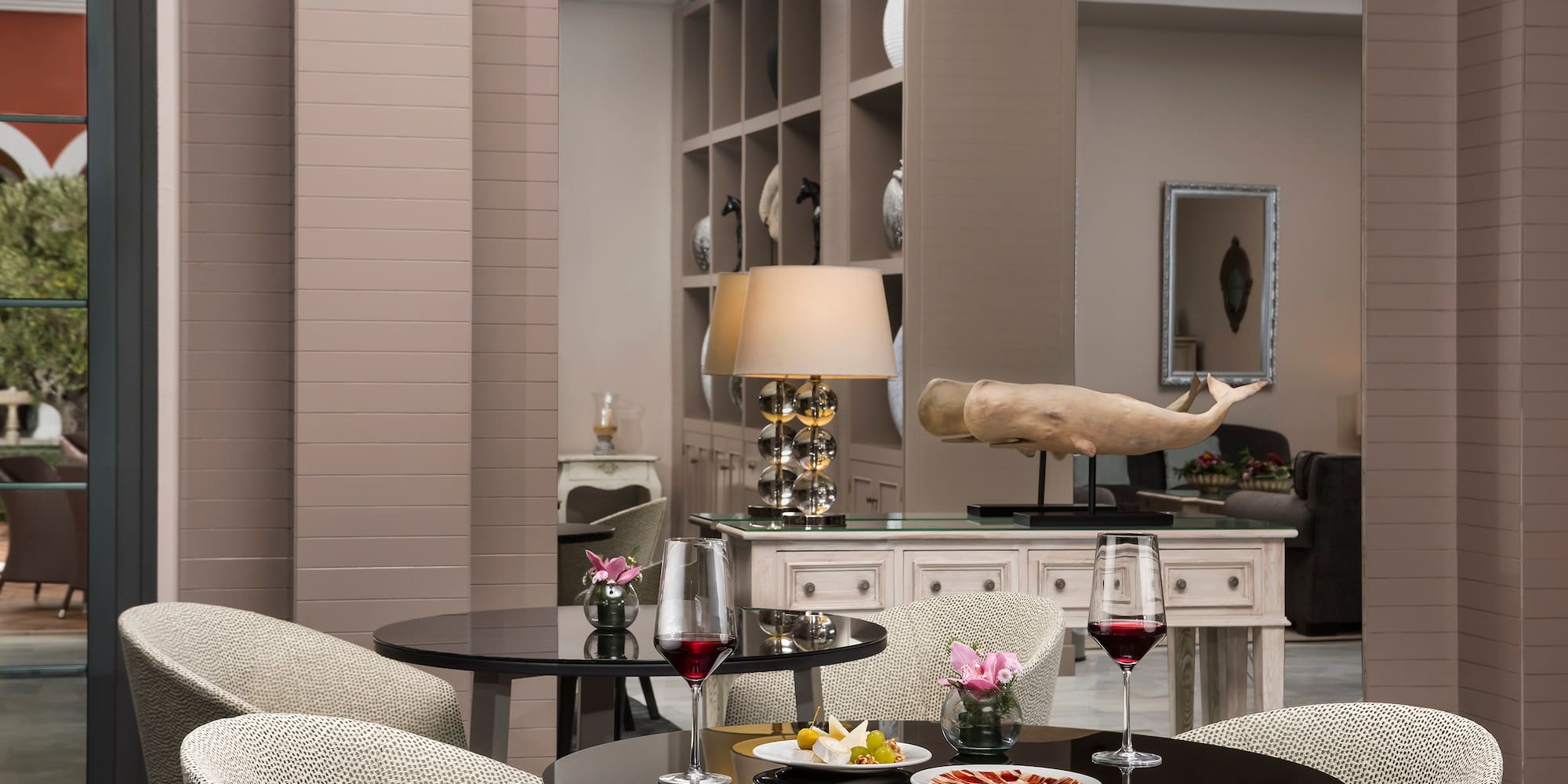 a table with food and wine glasses in a room