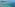a beach with palm trees and blue water