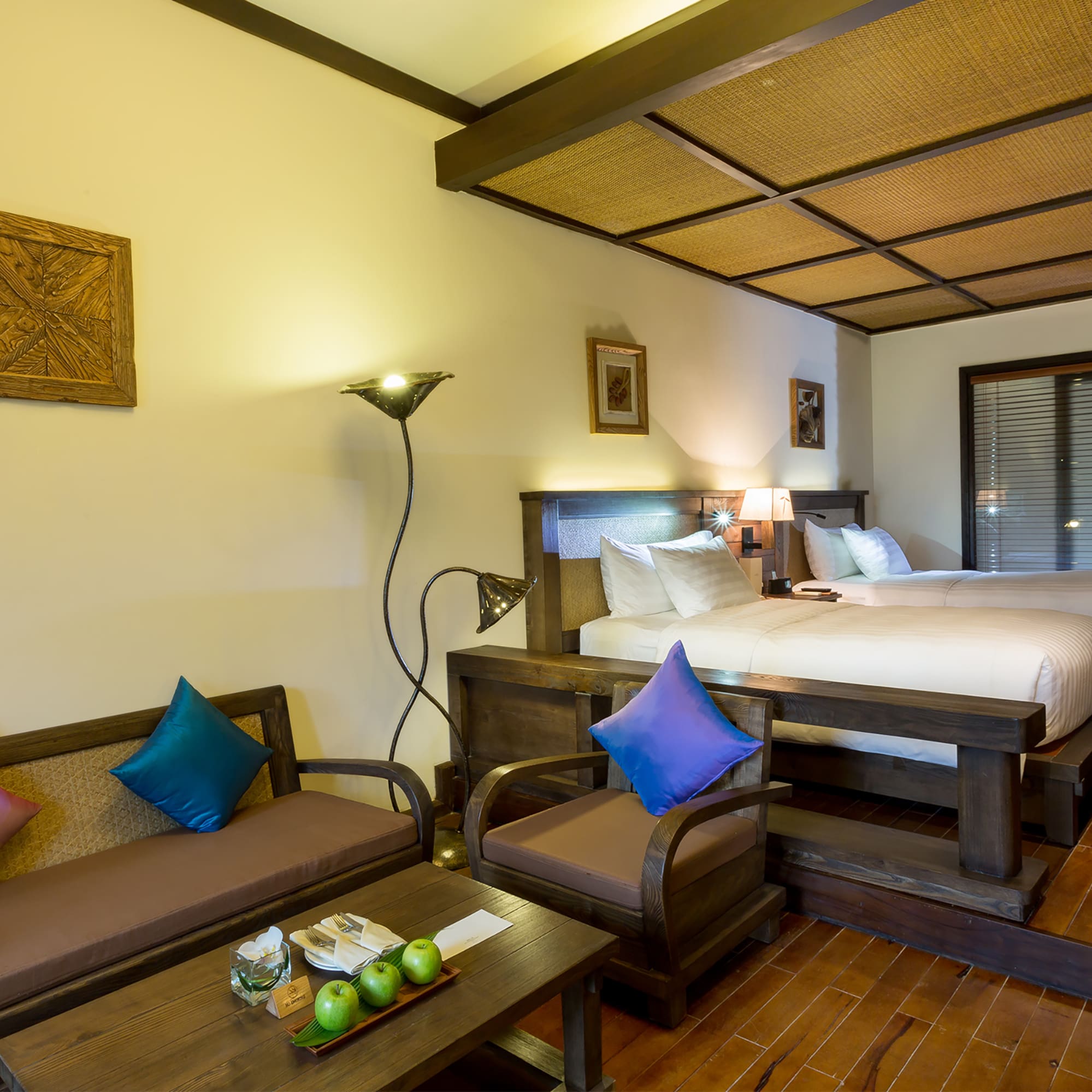 a room with two beds and a table