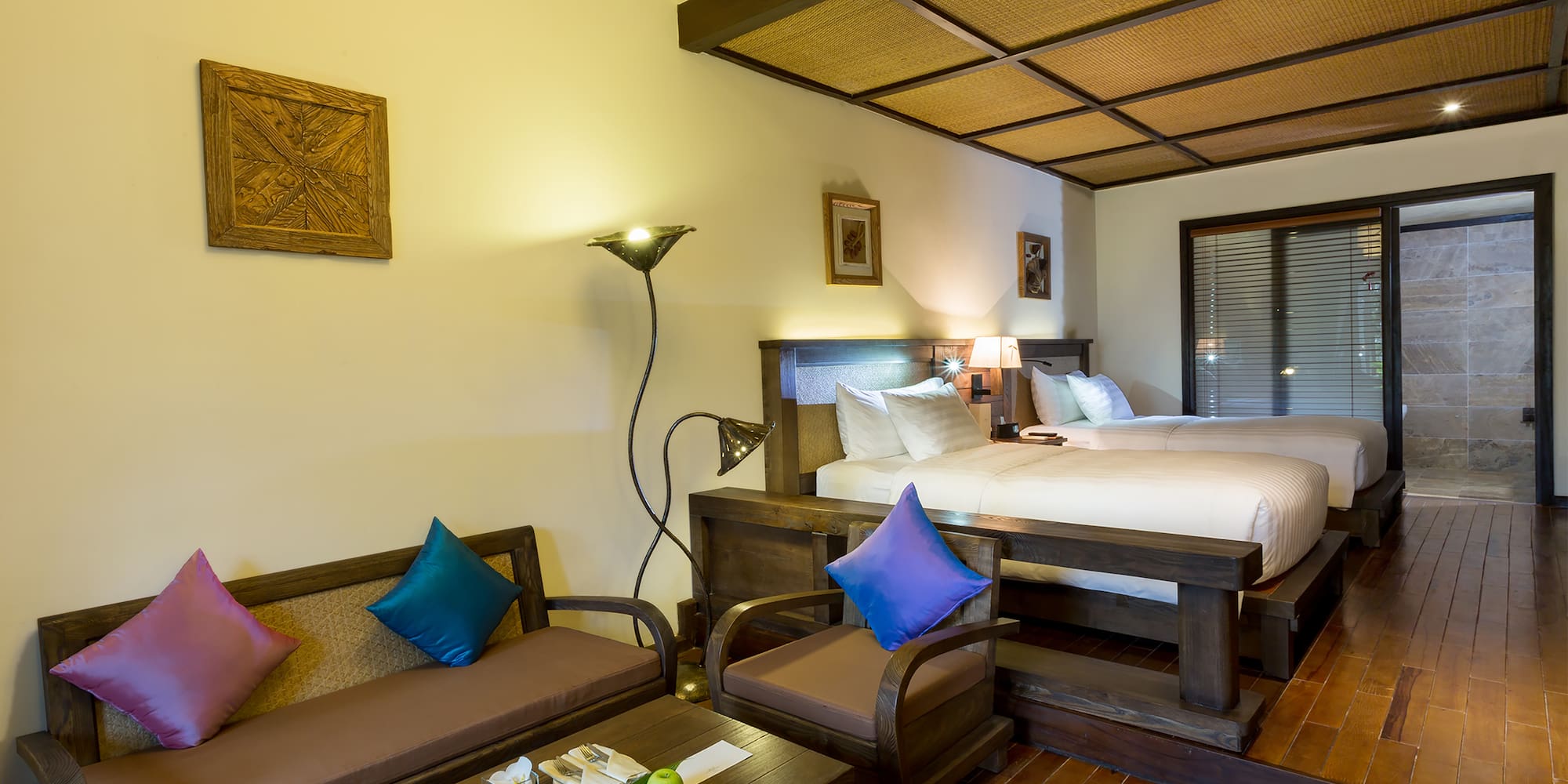 a room with two beds and a table