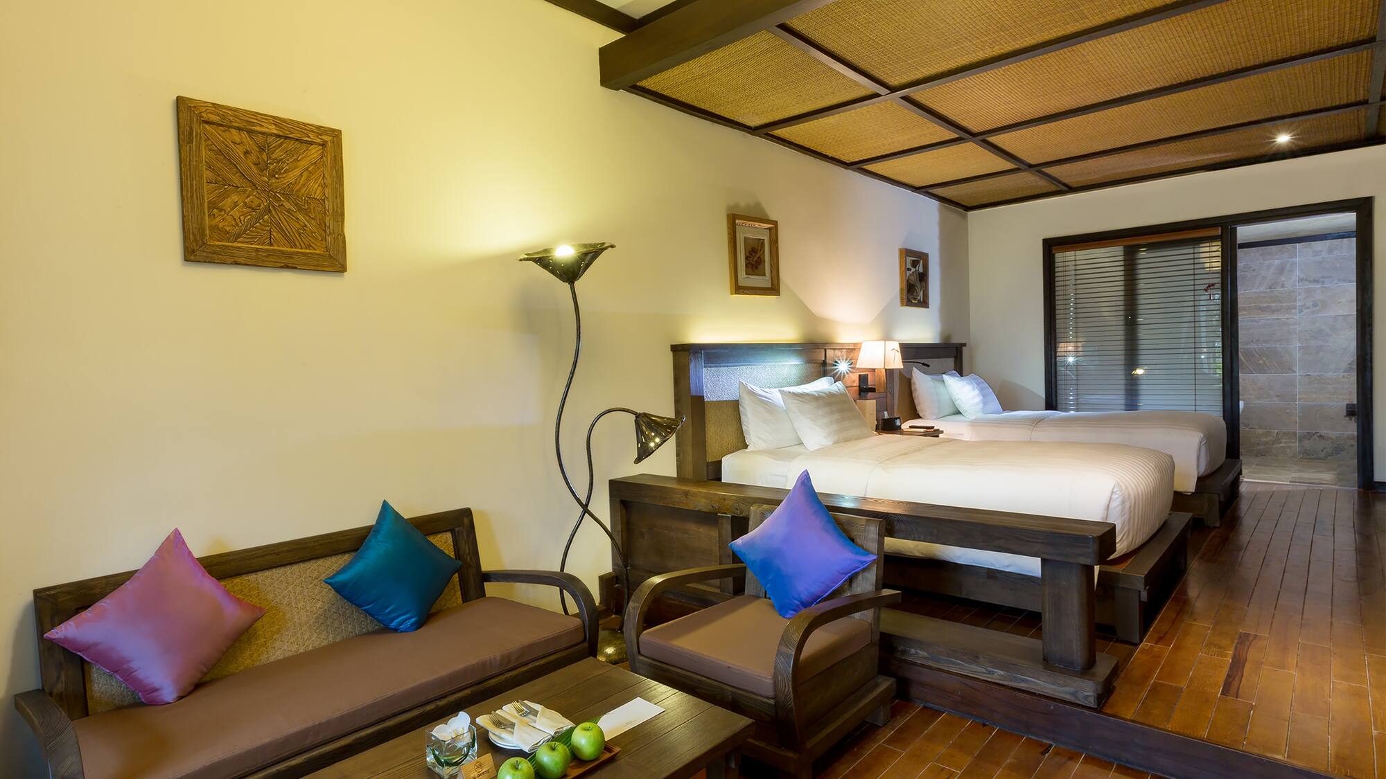 a room with two beds and a table