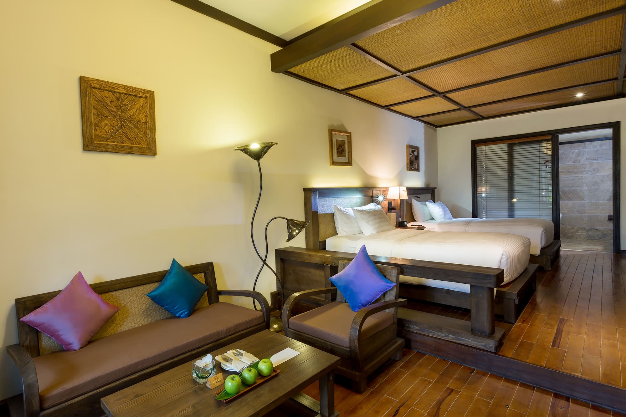 a room with two beds and a table