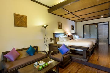 a room with two beds and a table