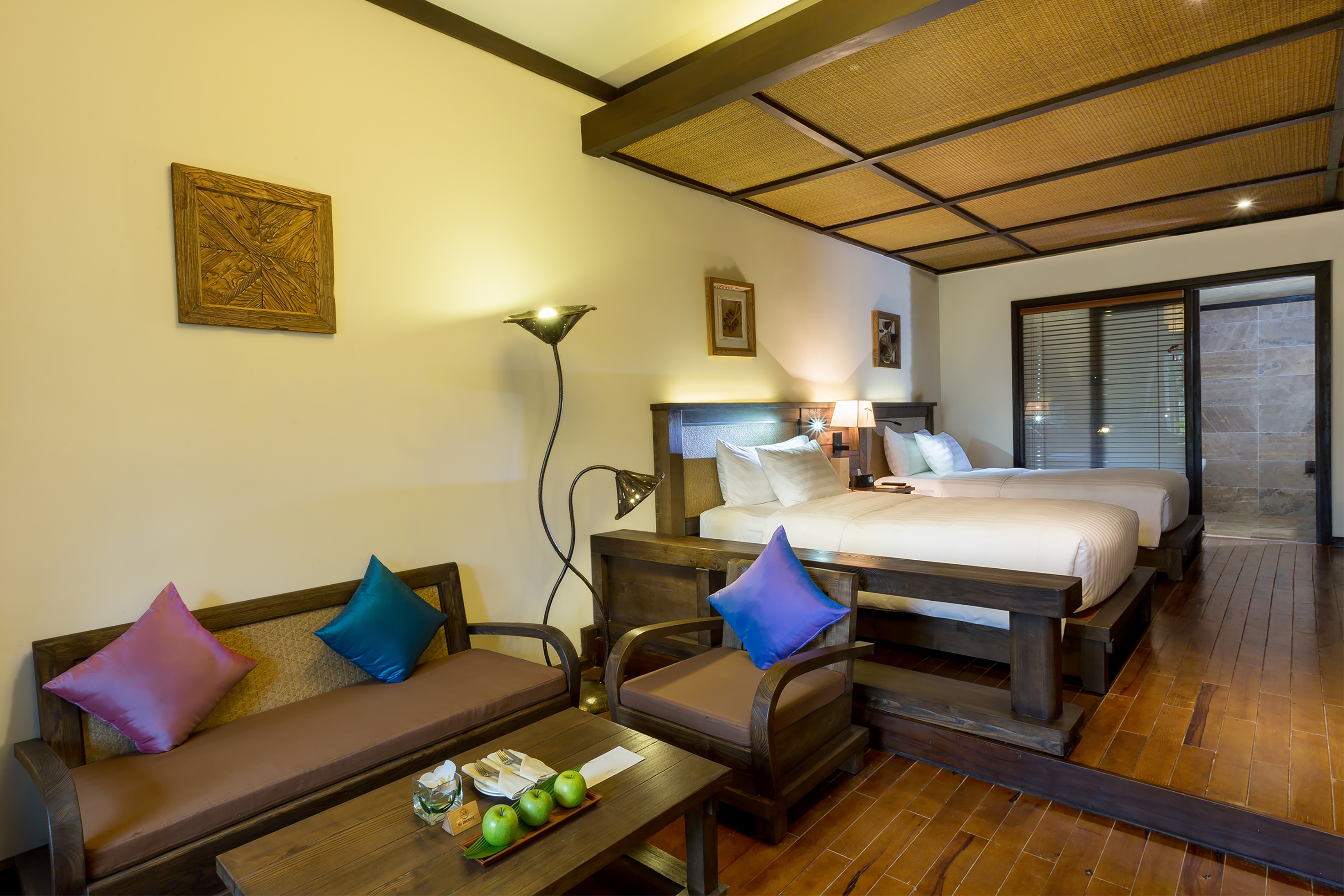 a room with two beds and a table