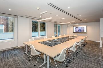 a conference room with a large table and chairs