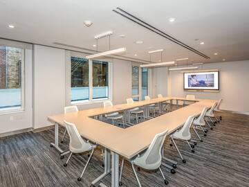 a conference room with a large table and chairs