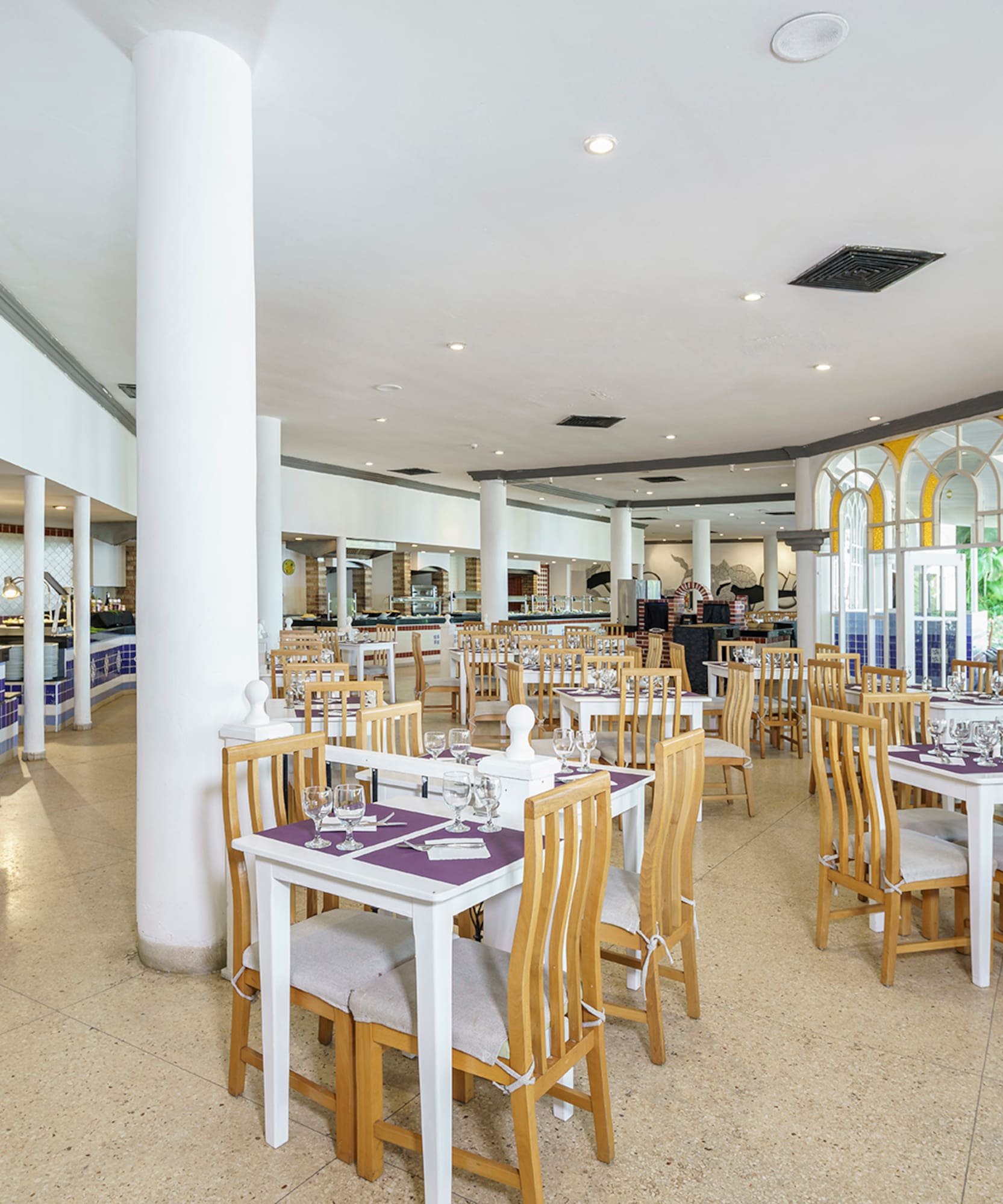 a restaurant with tables and chairs