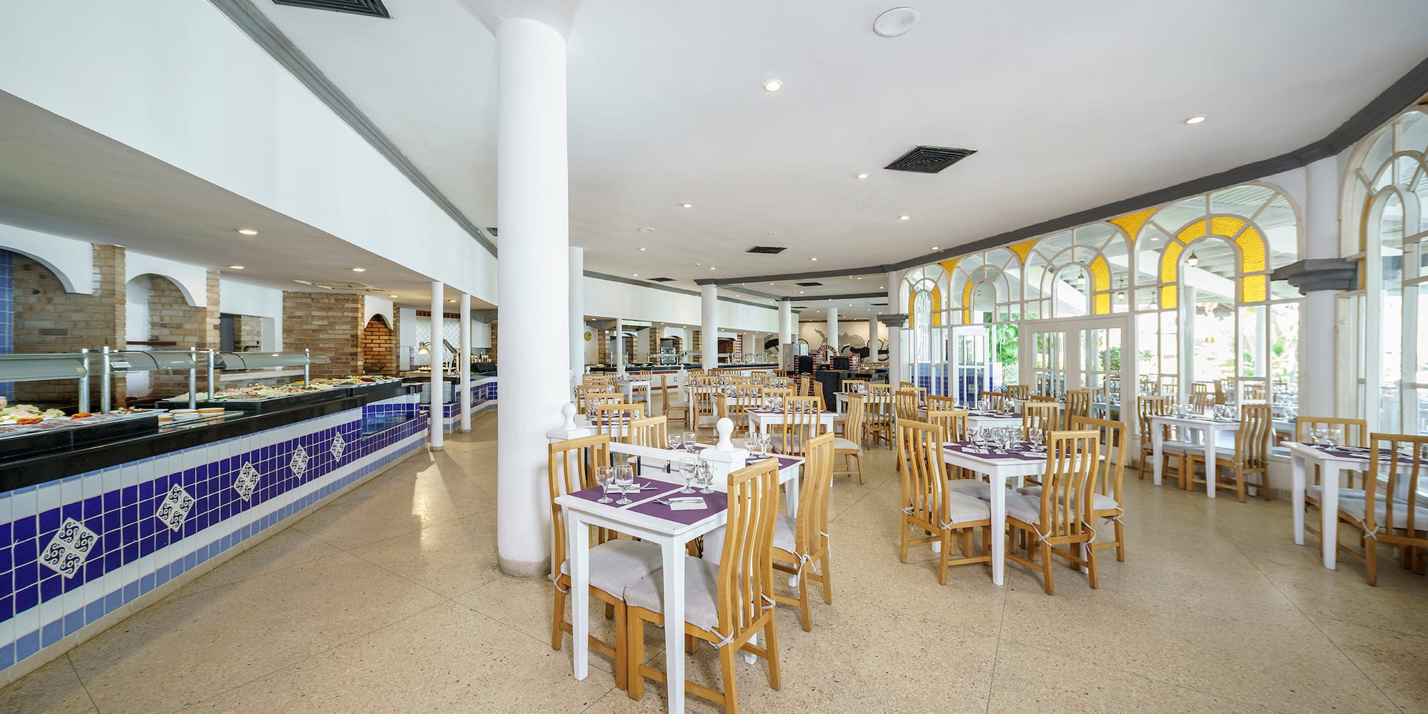 a restaurant with tables and chairs
