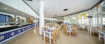 a restaurant with tables and chairs