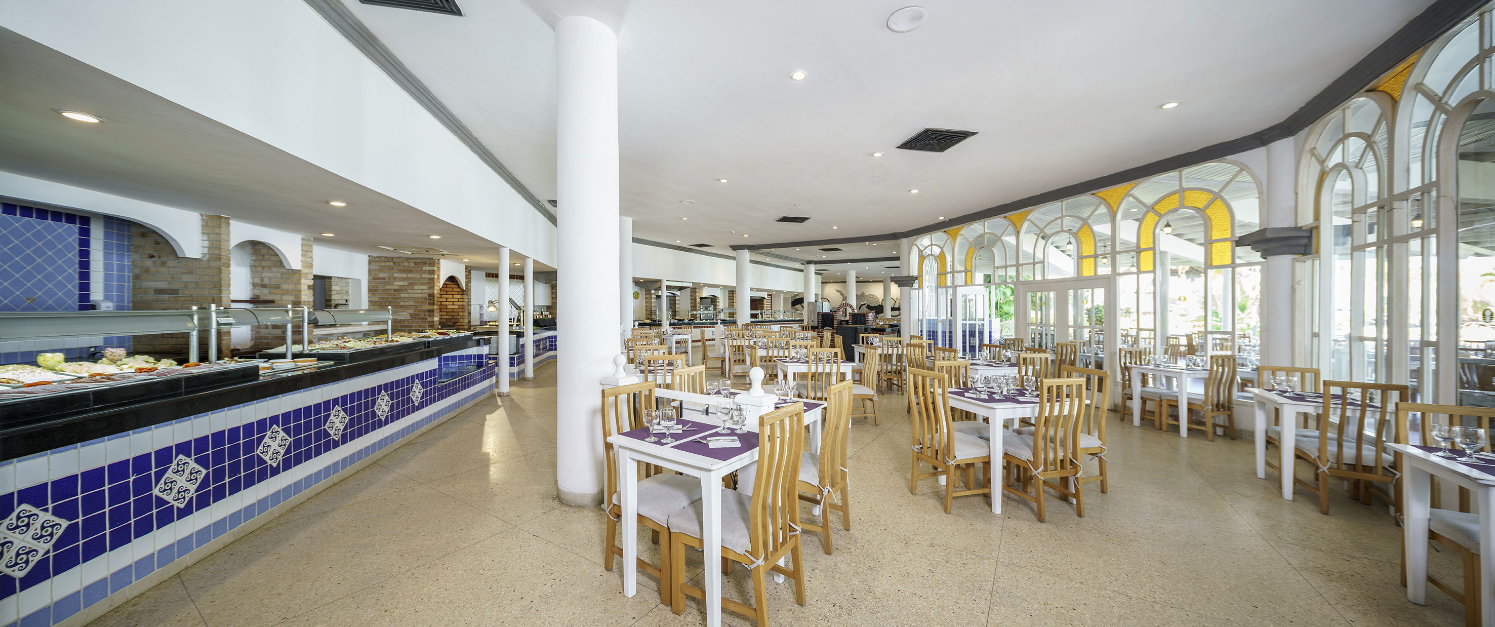 a restaurant with tables and chairs