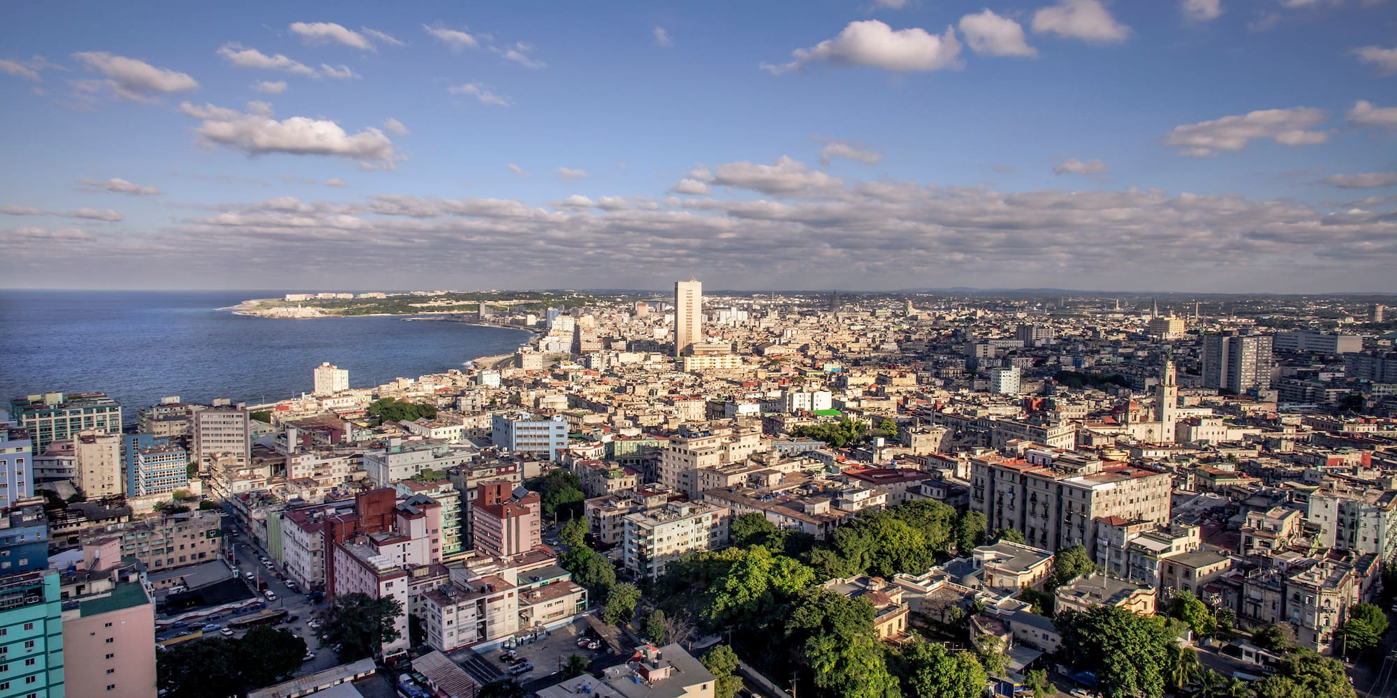 a city with many buildings and a body of water
