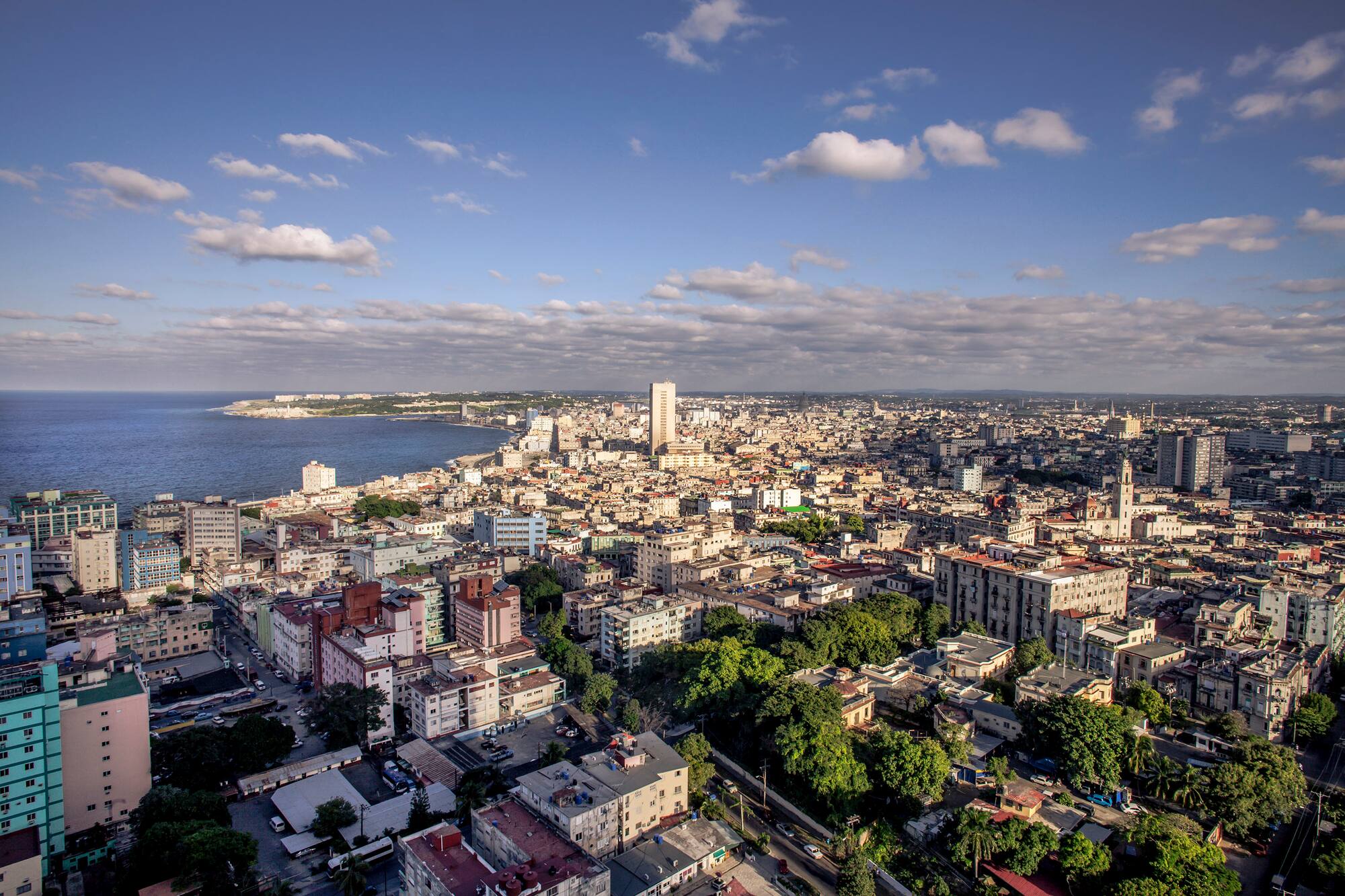 a city with many buildings and a body of water