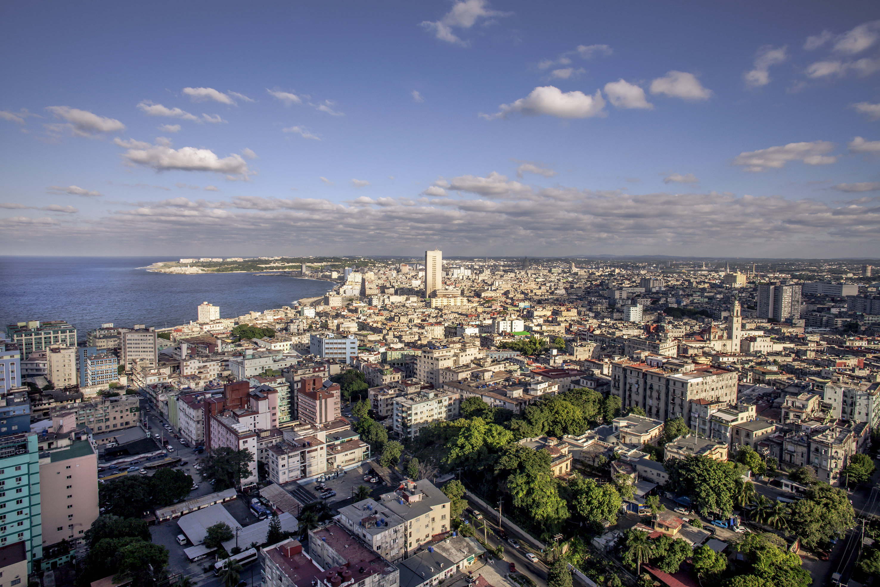 a city with many buildings and a body of water