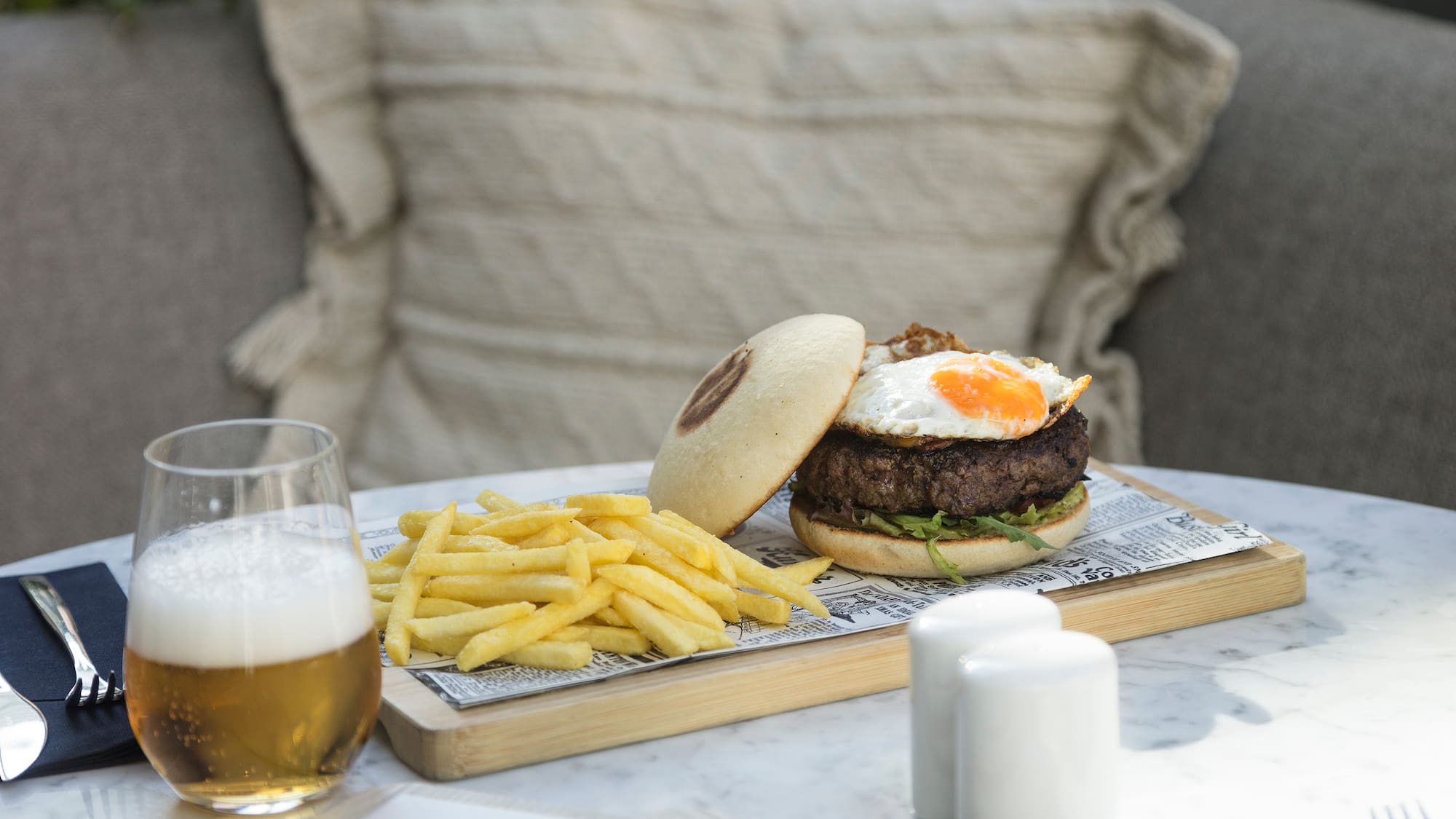 a burger and fries on a tray