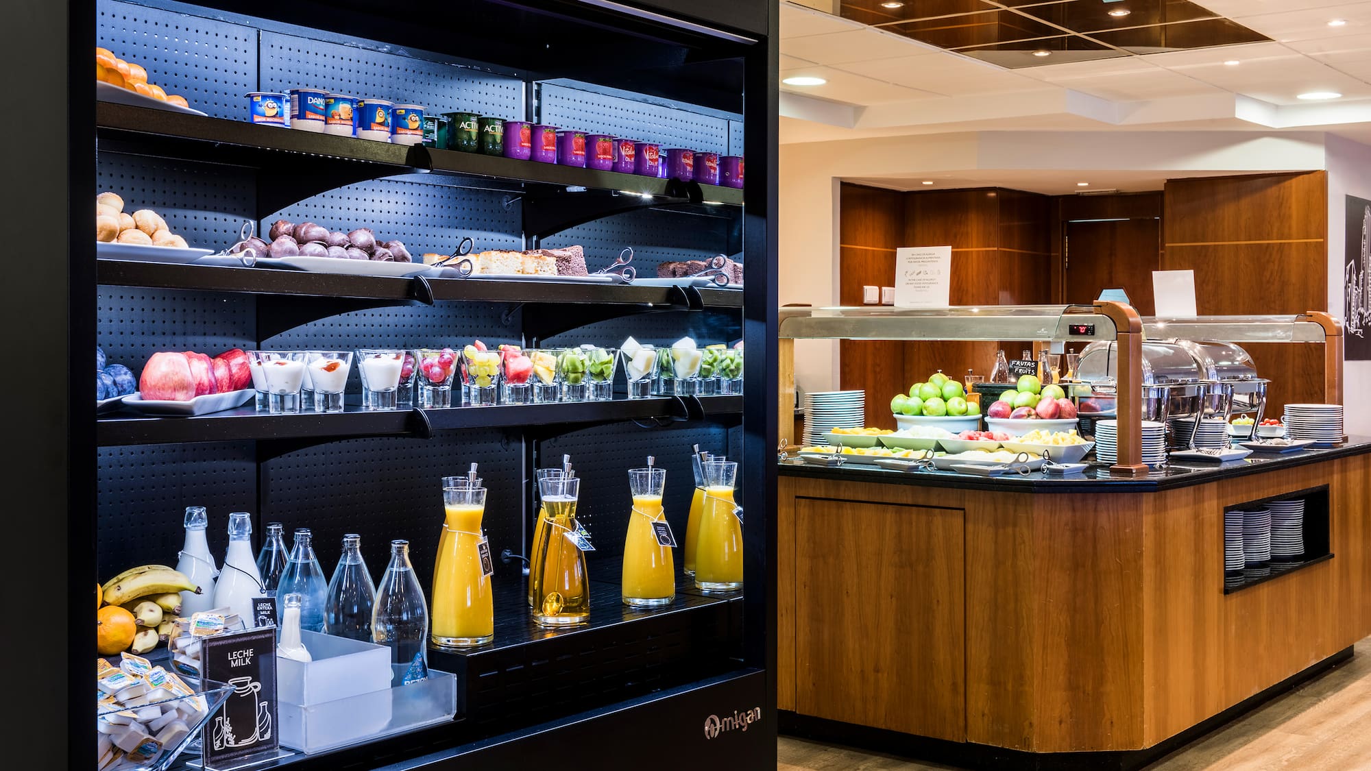 a display case with drinks and beverages on shelves