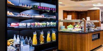 a display case with drinks and beverages on shelves