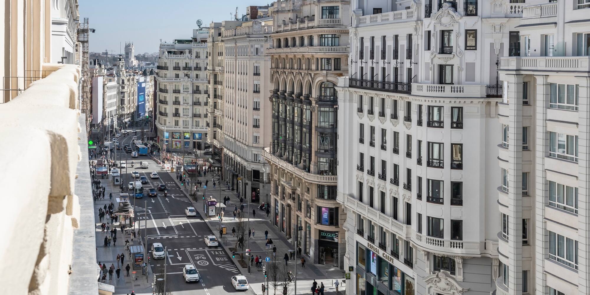 a city street with many buildings and cars