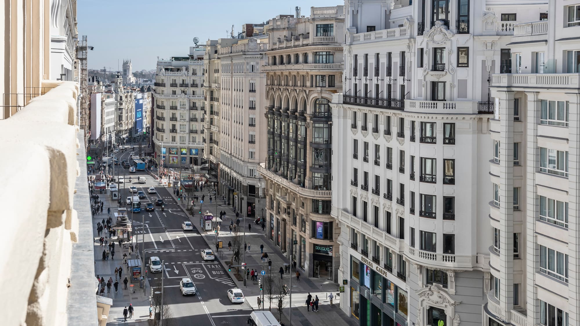 a city street with many buildings and cars