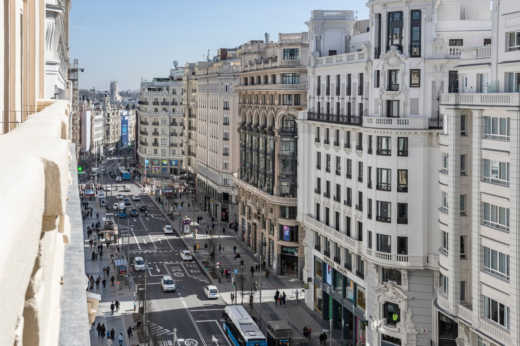 a city street with many buildings and cars