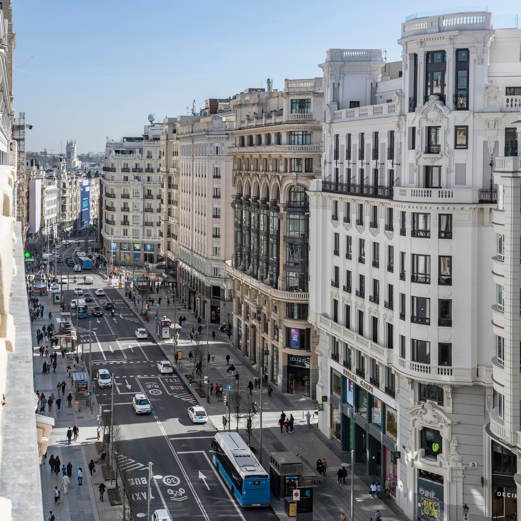 a city street with many buildings and cars