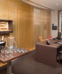 a room with a table and chairs