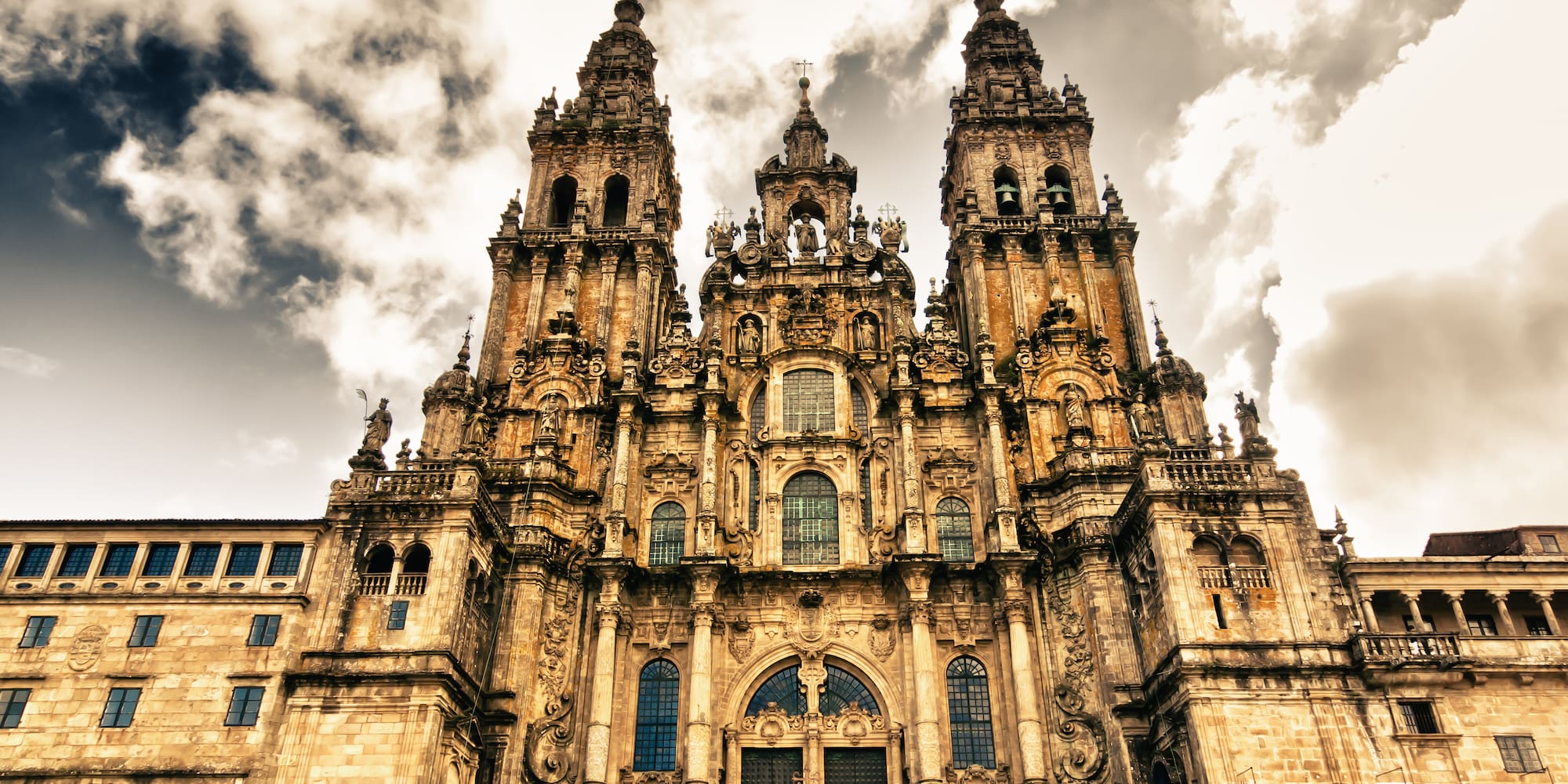 a large stone building with many towers