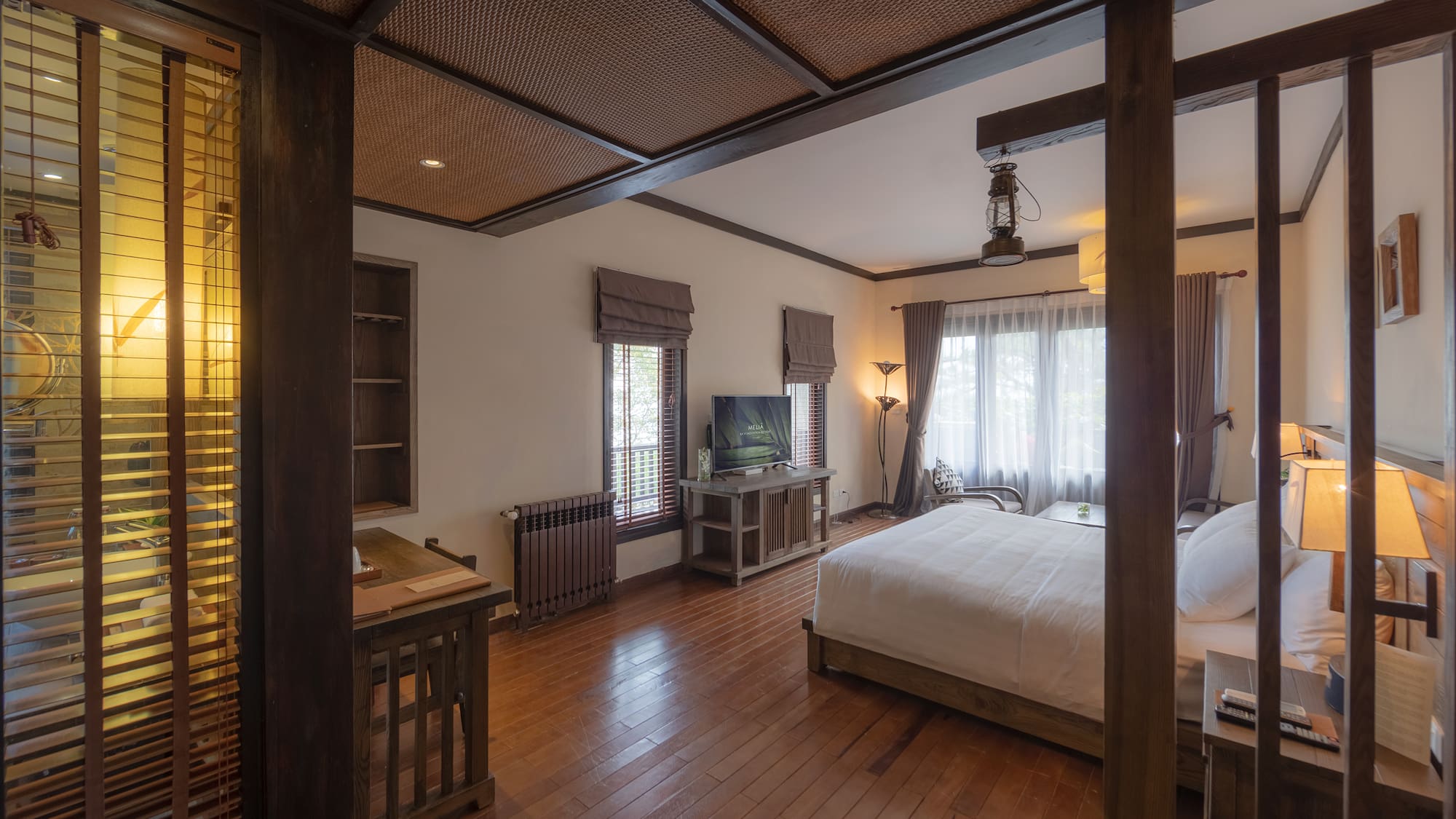 a bedroom with a wood floor and a wood floor