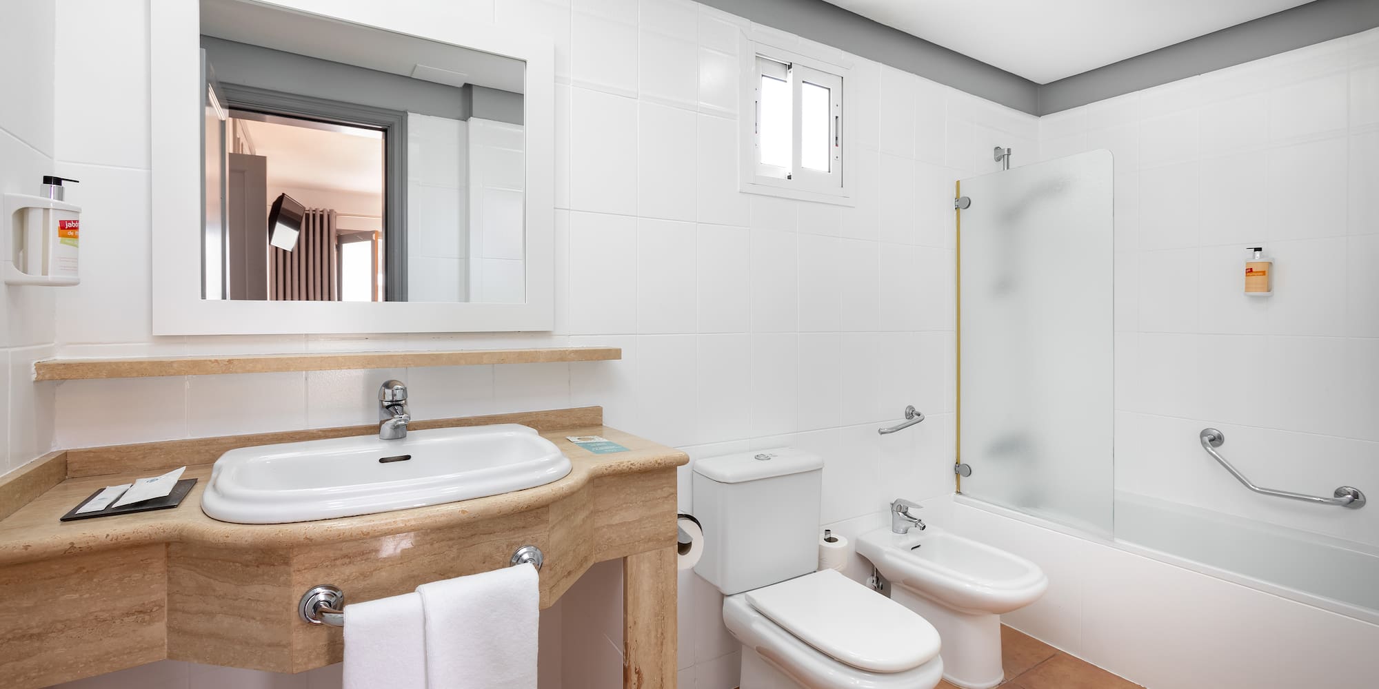 a bathroom with a sink and toilet