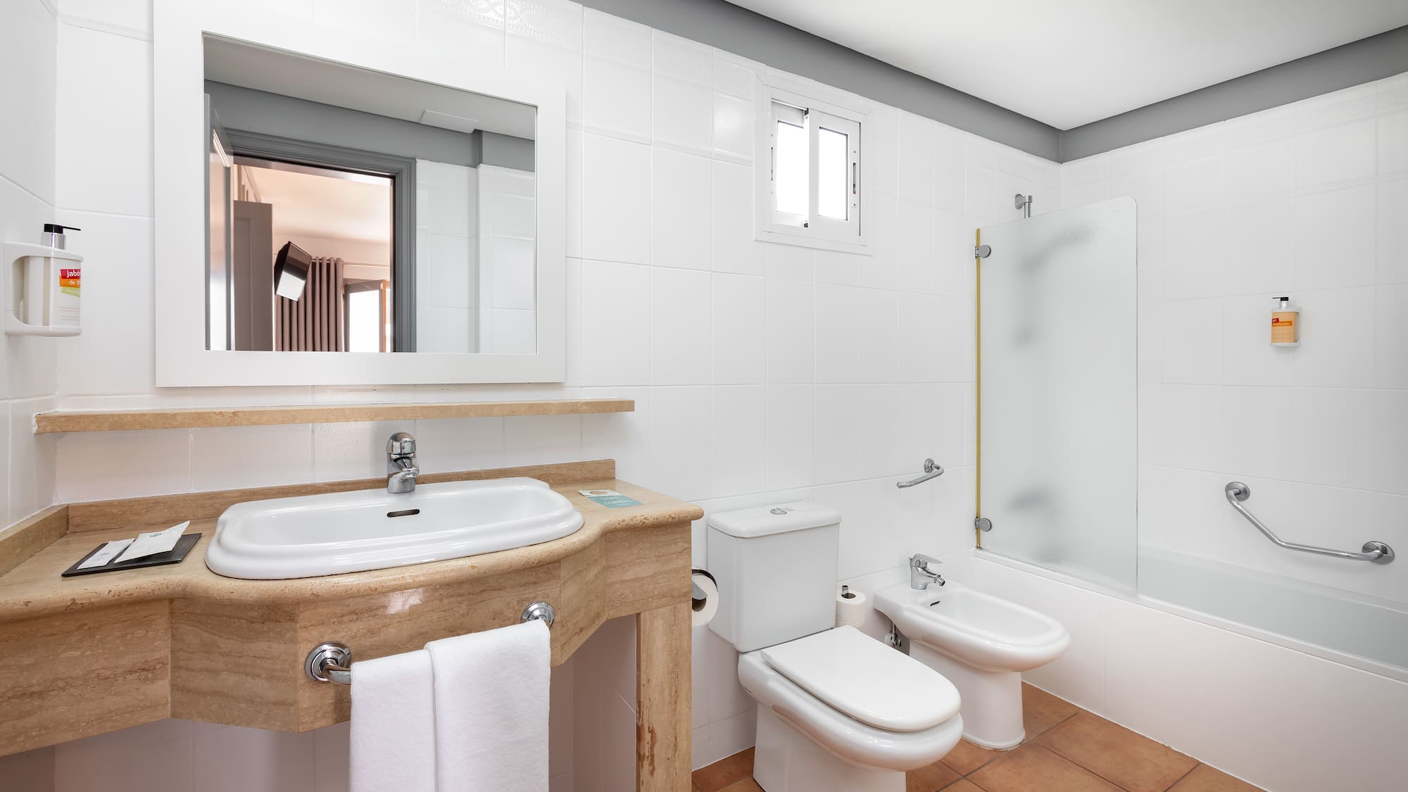 a bathroom with a sink and toilet