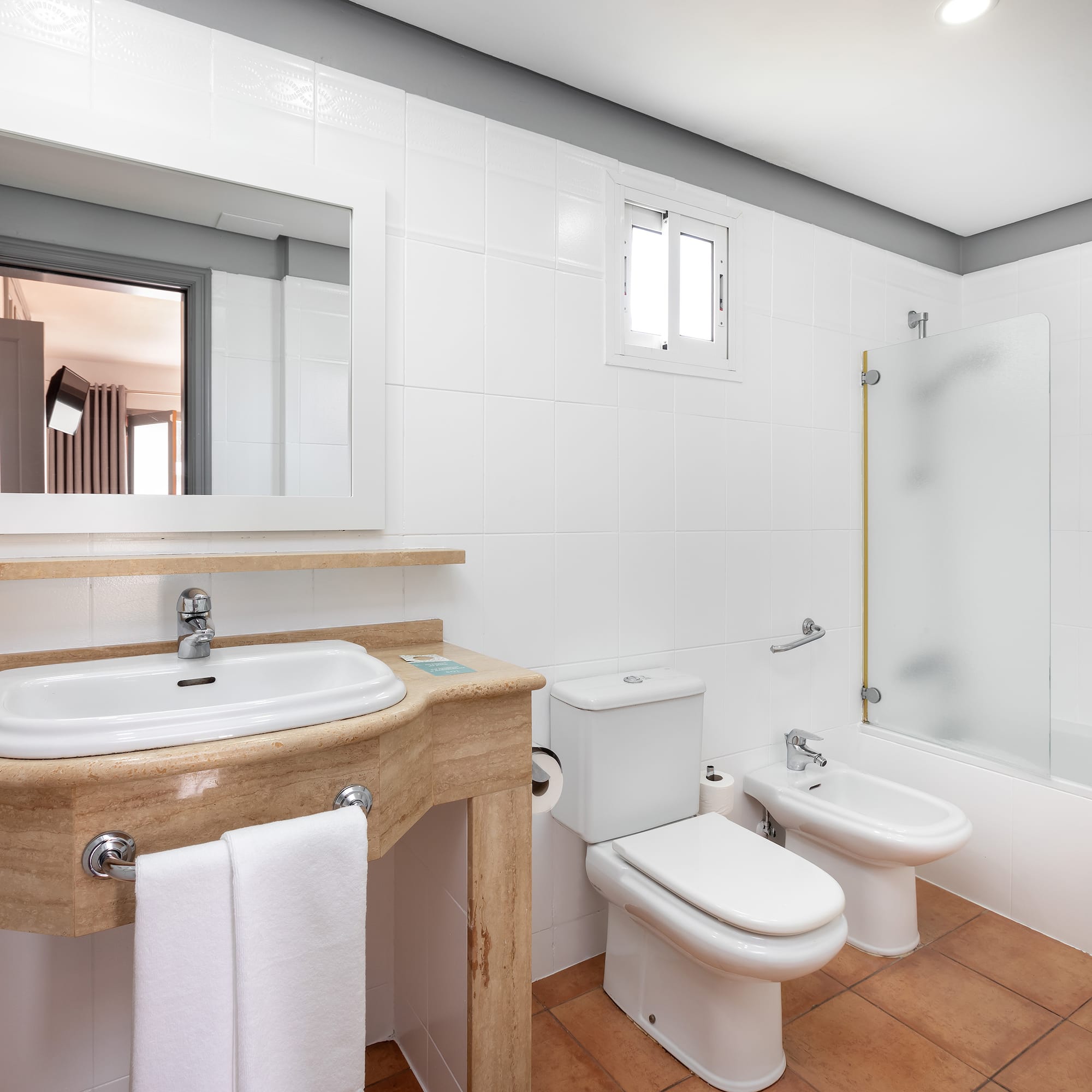 a bathroom with a sink and toilet