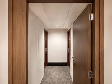 a hallway with two doors