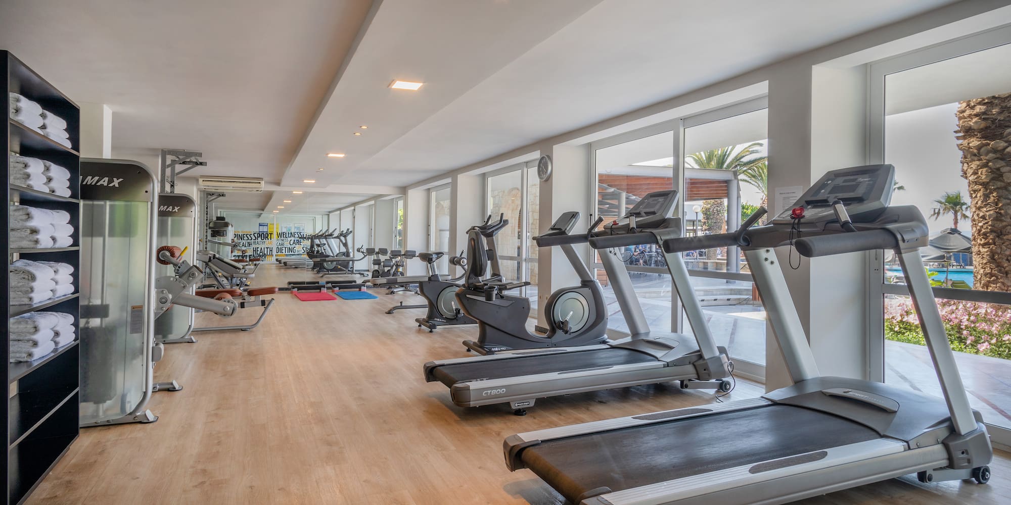 a room with treadmills and exercise equipment