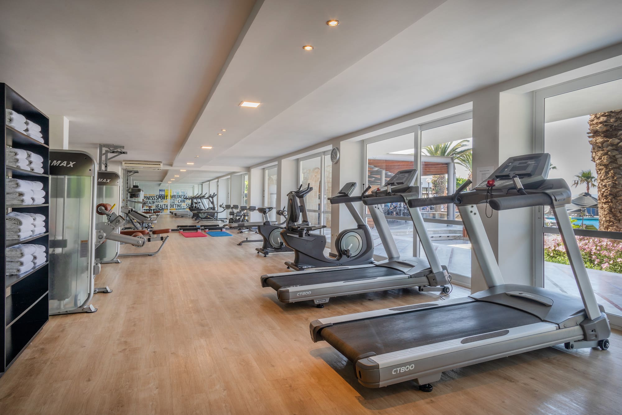 a room with treadmills and exercise equipment