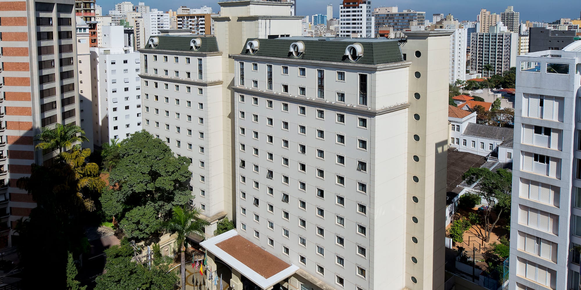 a tall white building with many windows