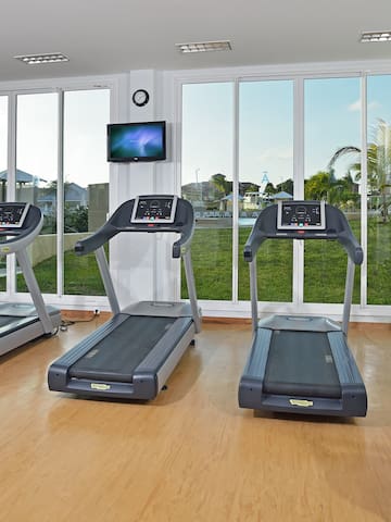 a room with treadmills and a window