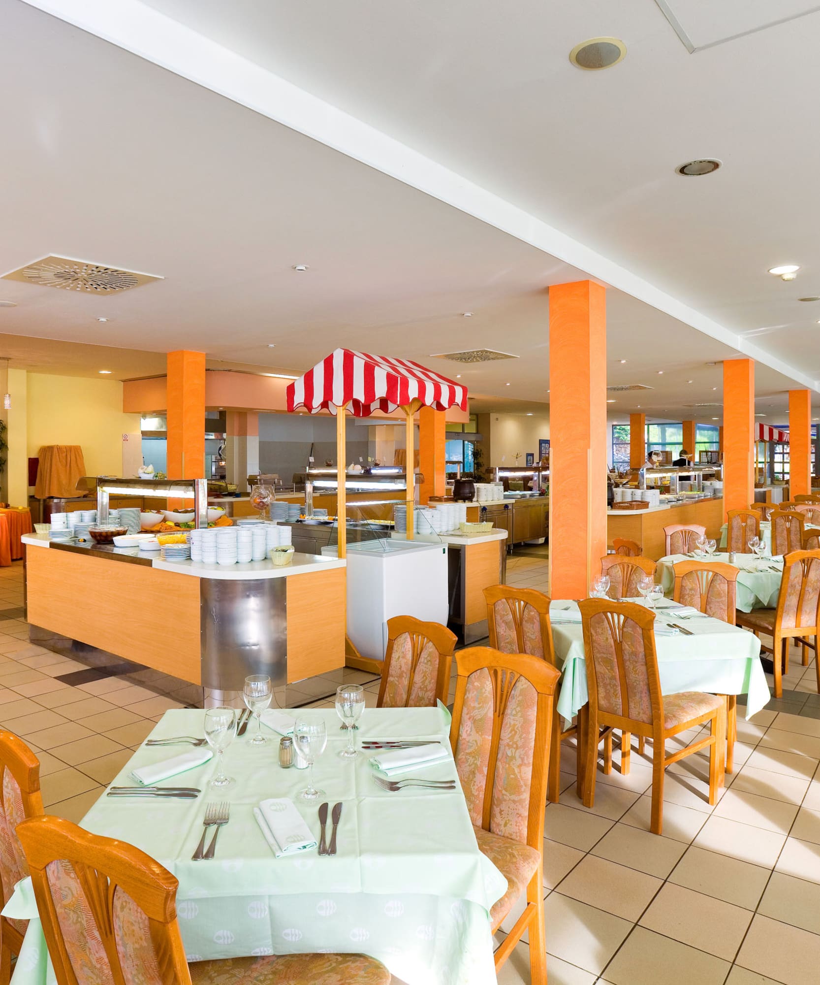 a restaurant with tables and chairs