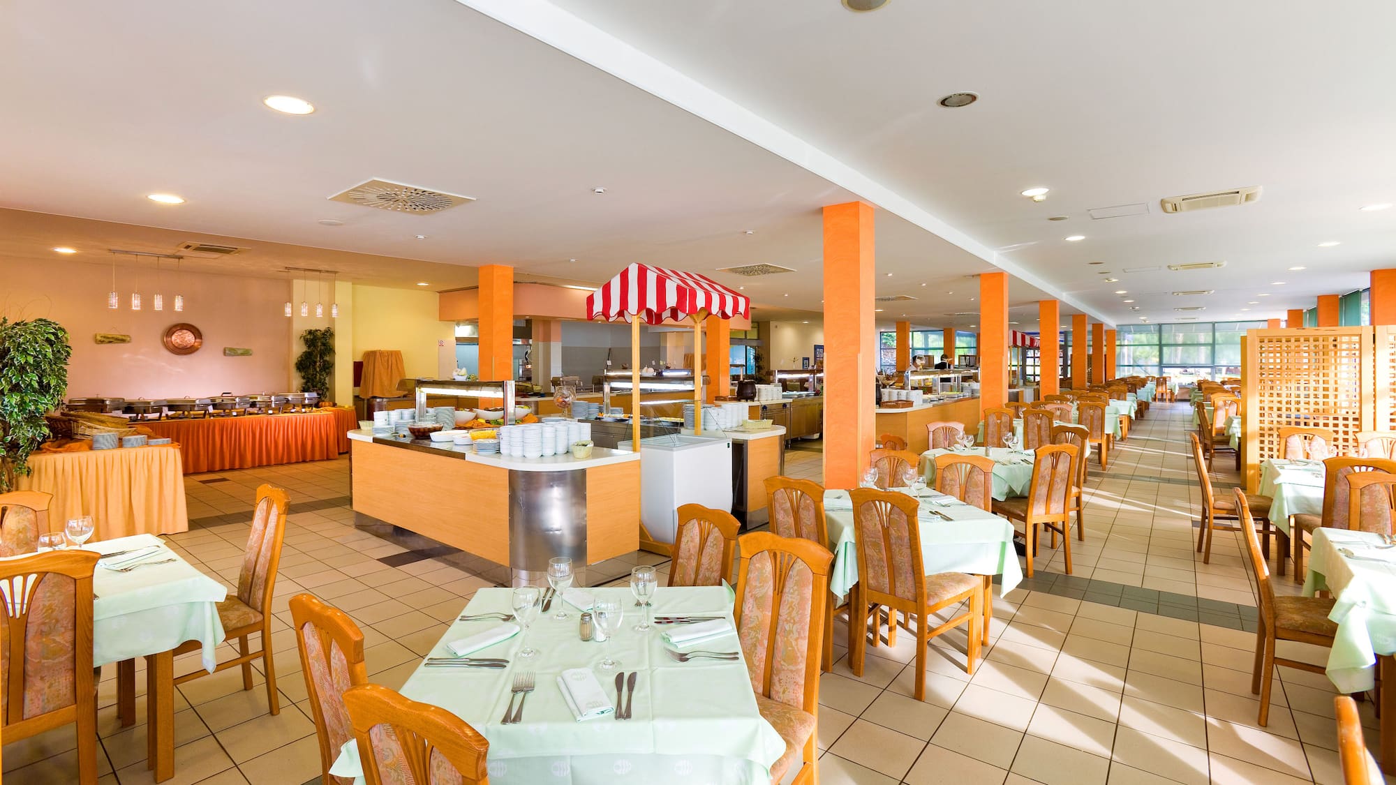 a restaurant with tables and chairs