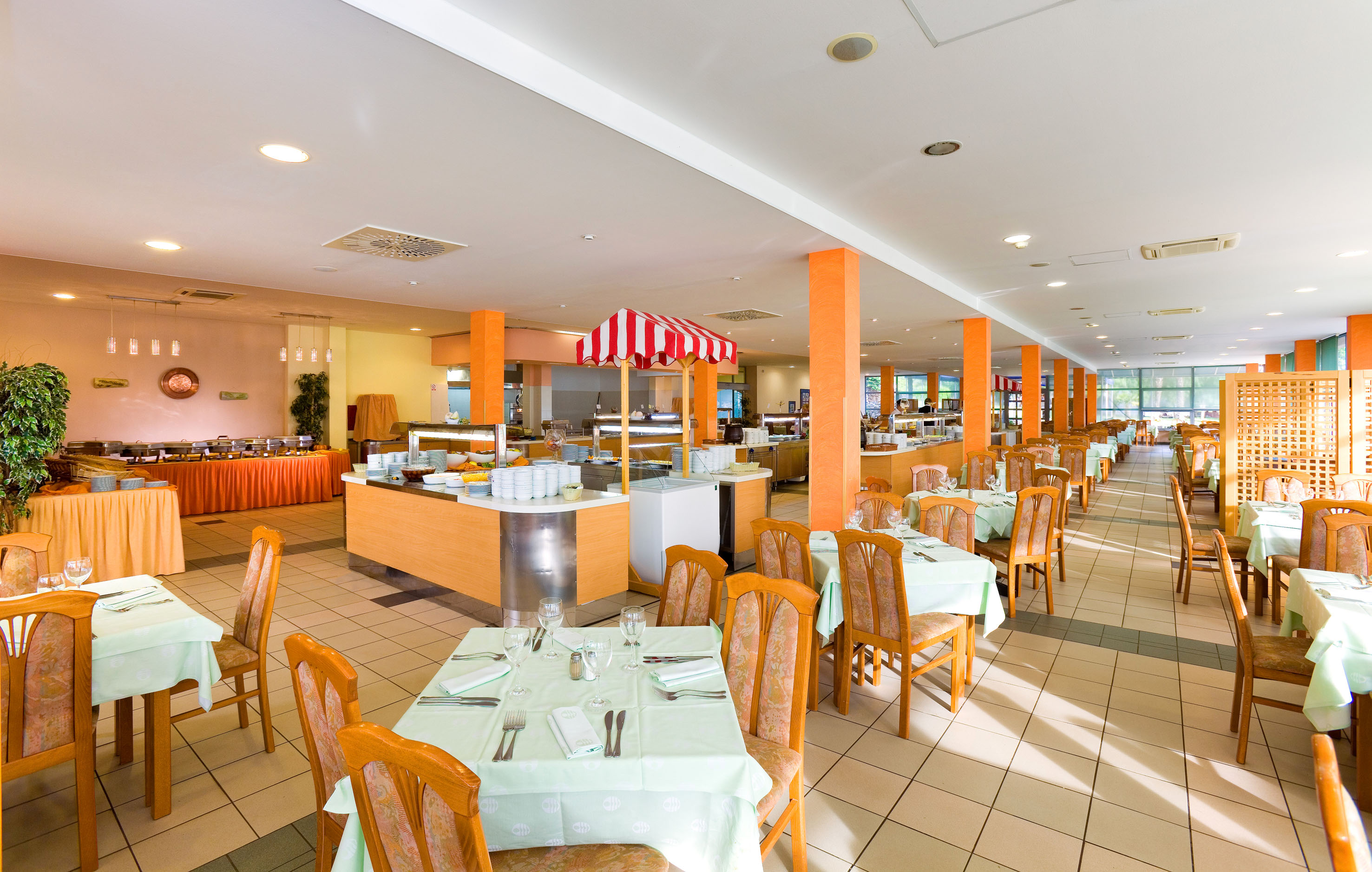 a restaurant with tables and chairs