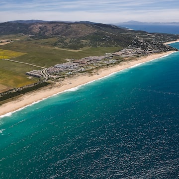 a beach with land and water