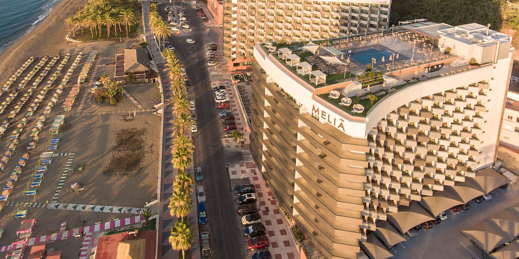 a large building next to a beach