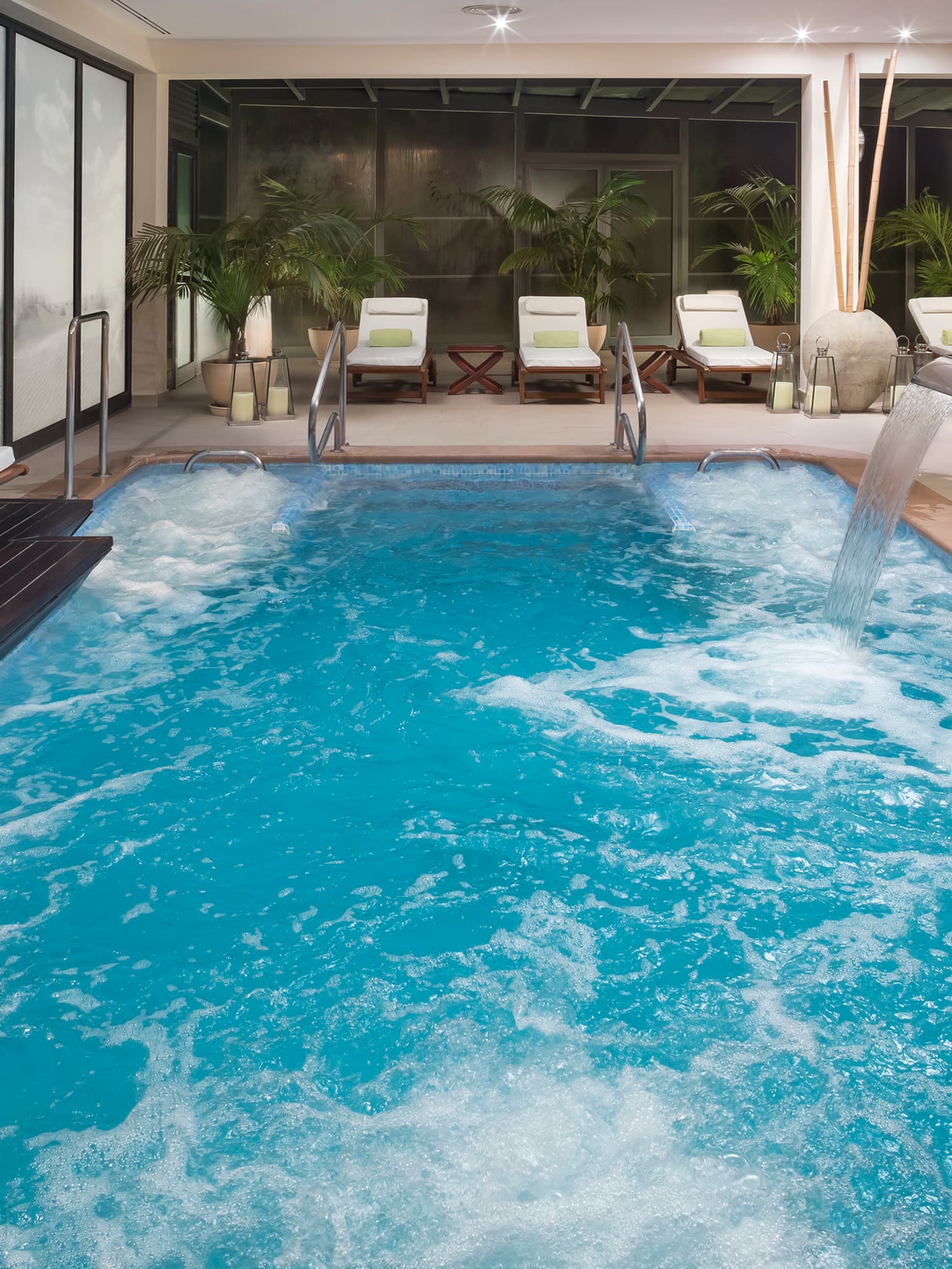 a swimming pool with a waterfall.