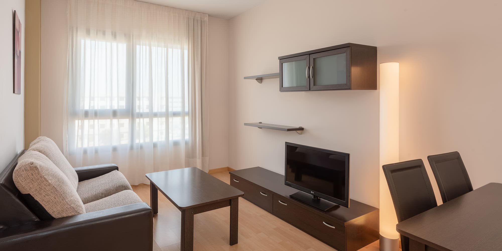 a living room with a couch and a tv