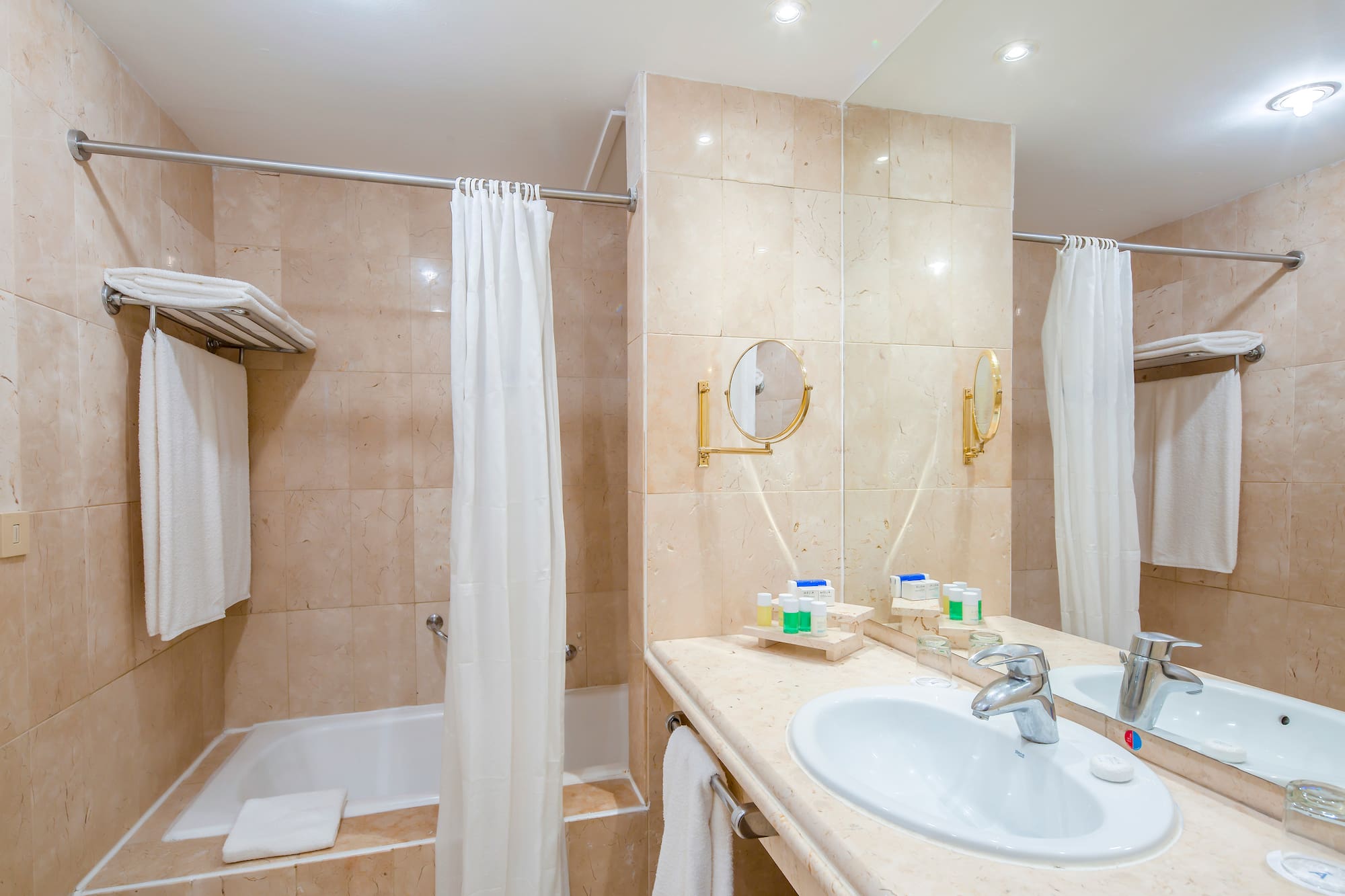 a bathroom with a sink and shower curtain