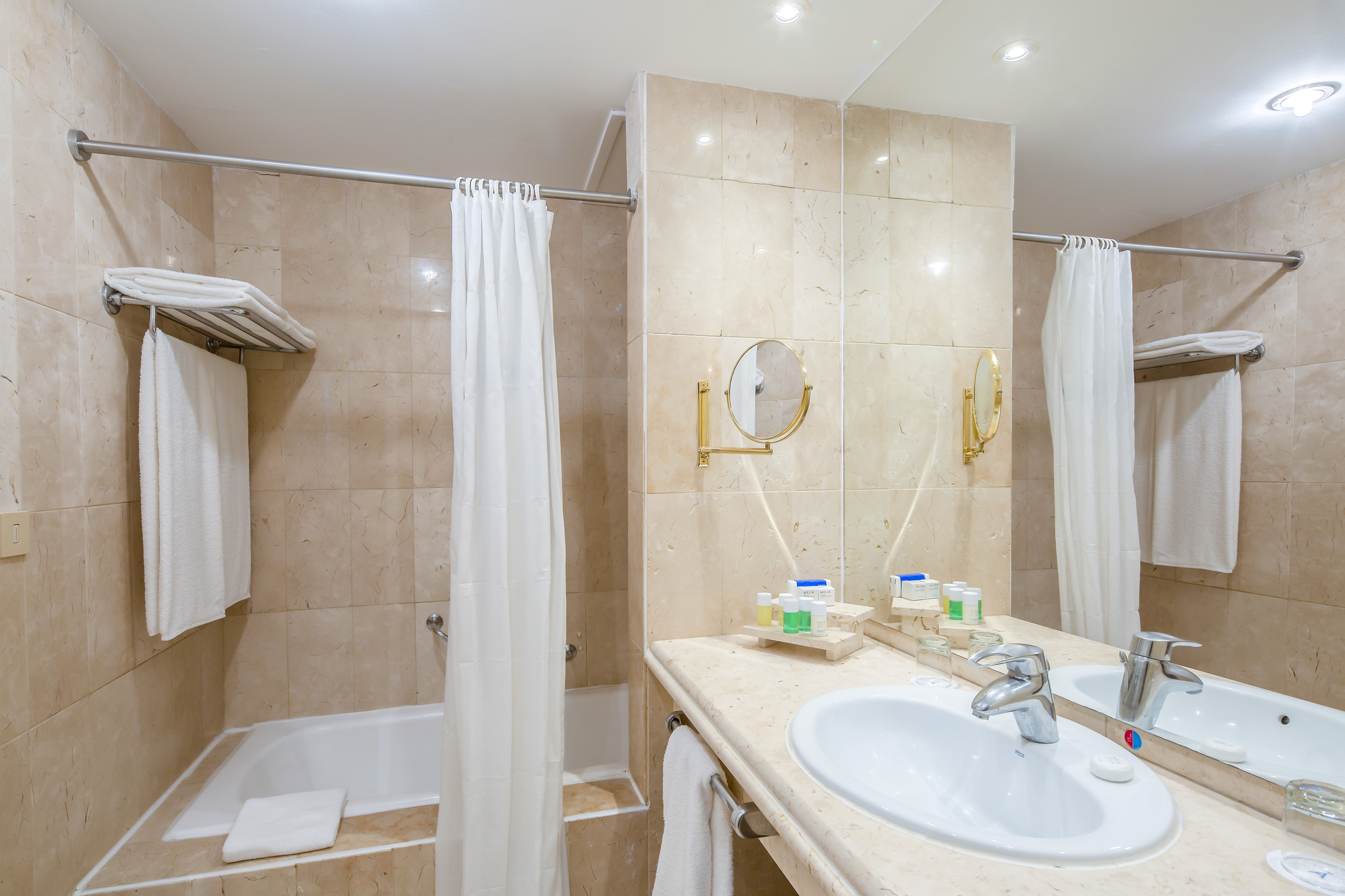 a bathroom with a sink and shower curtain