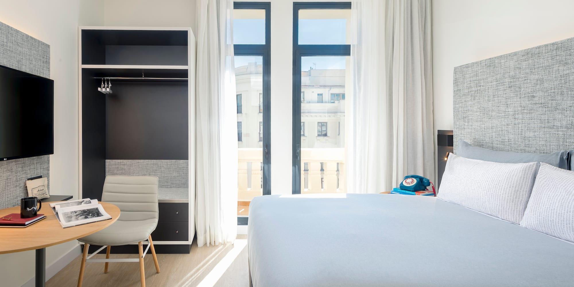 a bedroom with a bed and a desk