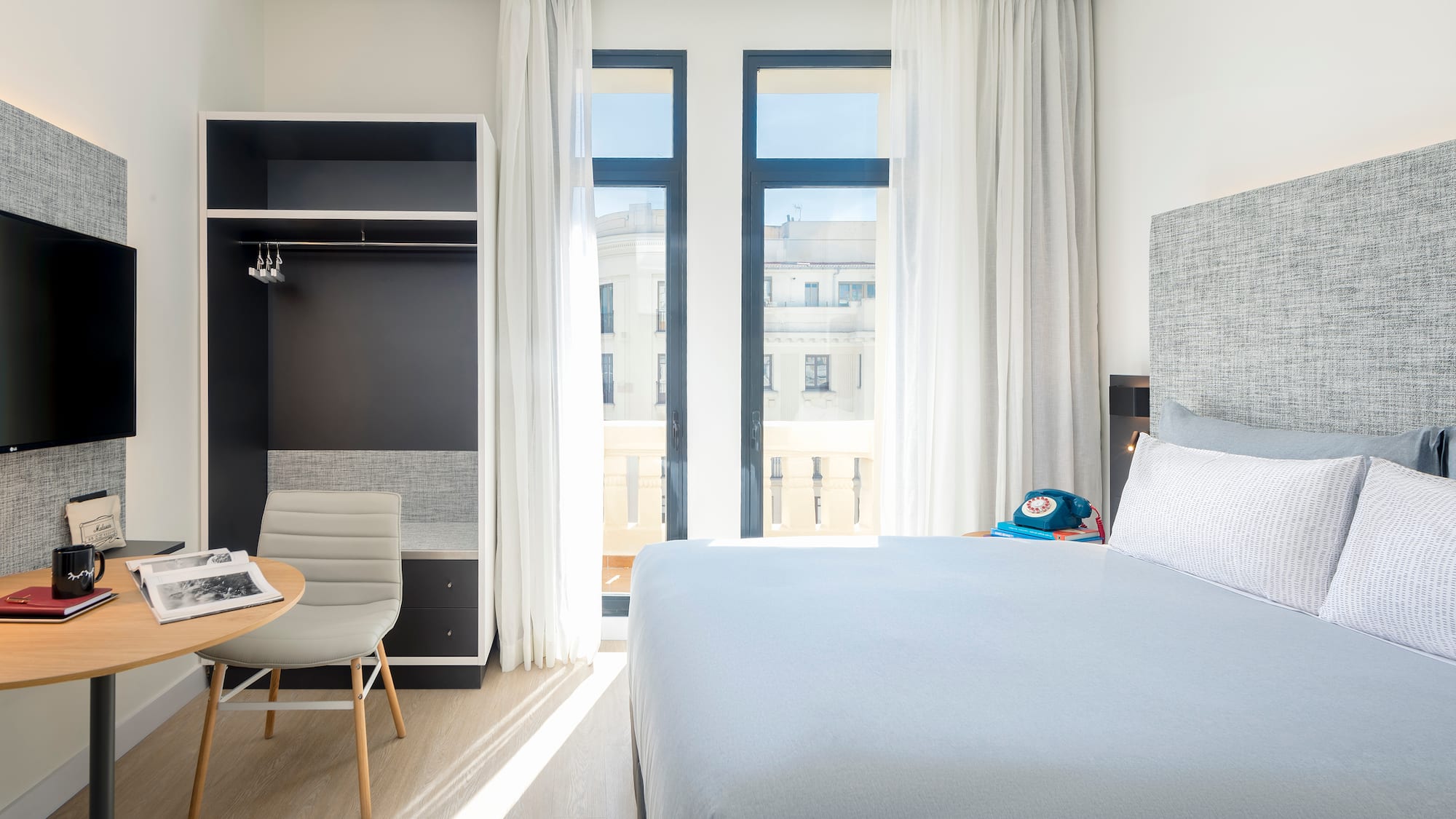 a bedroom with a bed and a desk