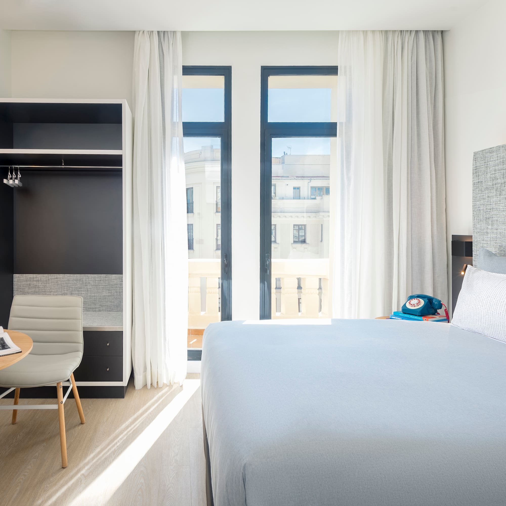 a bedroom with a bed and a desk