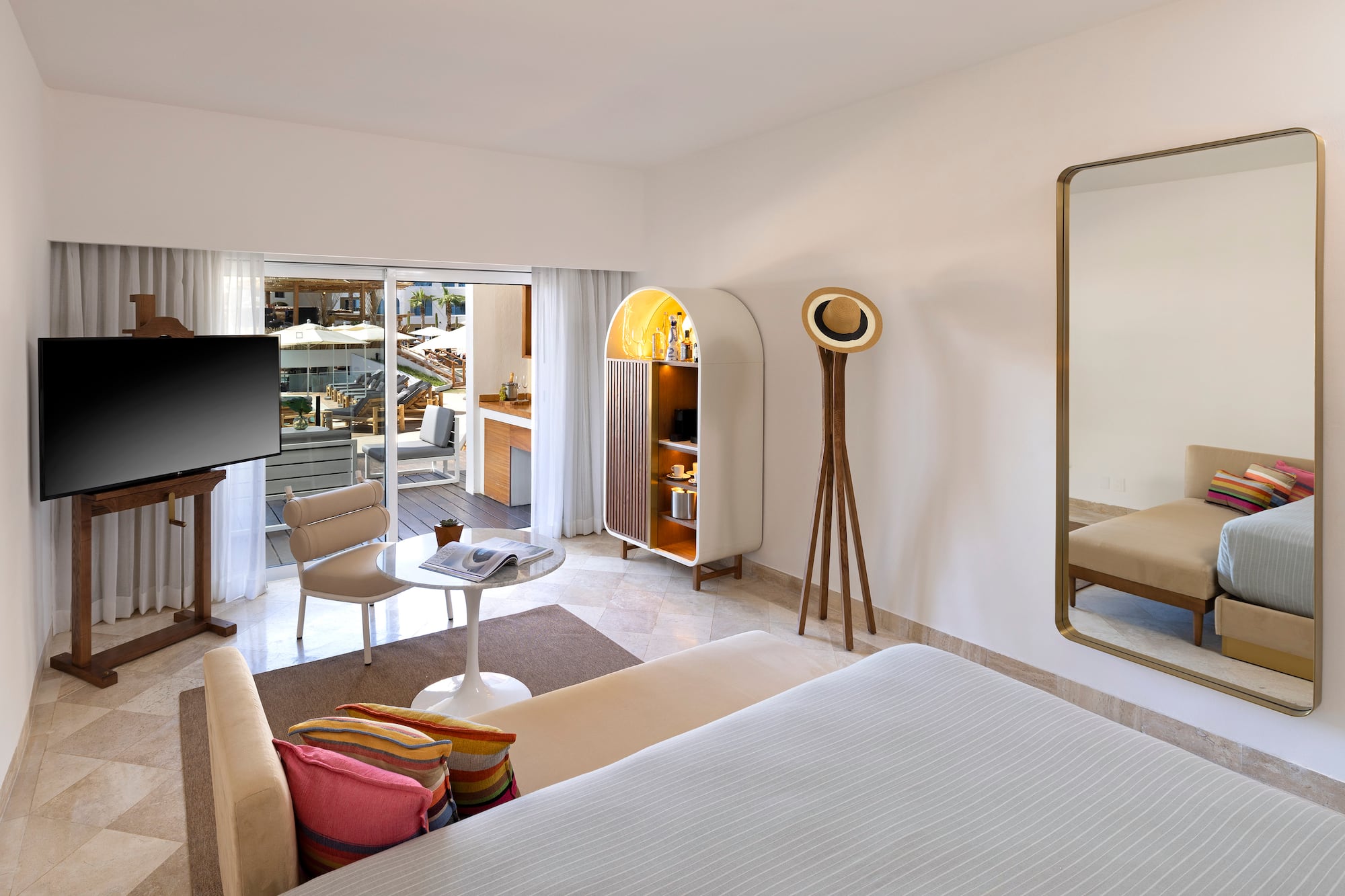 a room with a television and a bed