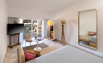 a room with a television and a bed