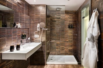 a bathroom with a shower and sink
